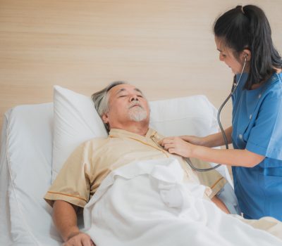 nursing-home-care-concept-the-healthy-nurse-helping-support-and-checking-the-elderly-male.jpg